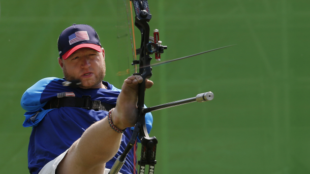 Matt Stutzman, of United States, holds the bow with his foot as he competes in the individual compound-open, during the Paralympic Games at the Sambadrome, in Rio de Janeiro, Brazil, Wednesday, Sept. 14, 2016.  He holds a world record for the most accurate distance shot in archery, which includes able-bodied archers. (AP Photo/Silvia Izquierdo)